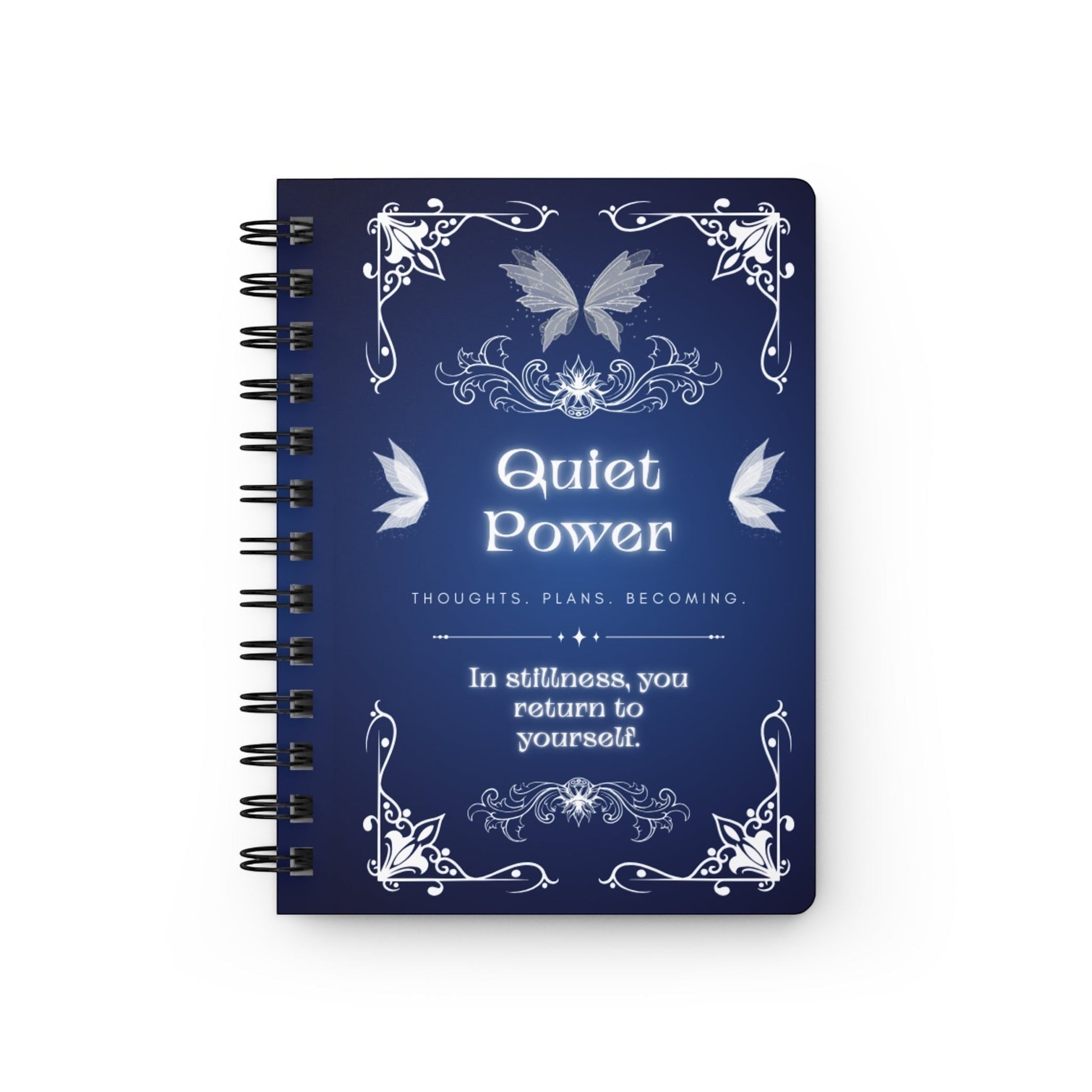 Jena Jewelry Quiet Power spiral notebook with a dark blue cover featuring ornate white filigree, butterflies, and inspirational text for personal growth and reflection.