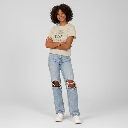 Jena Jewelry light beige 100% cotton t-shirt with a graphic print of a reading cat and the text "I CAN'T I am busy". Relaxed fit, crew neck.
