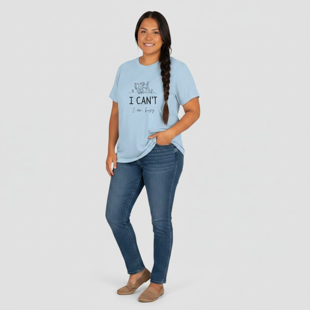 Jena Jewelry light blue 100% cotton t-shirt with a line drawing of a person reading and the text "I CAN'T I am busy".