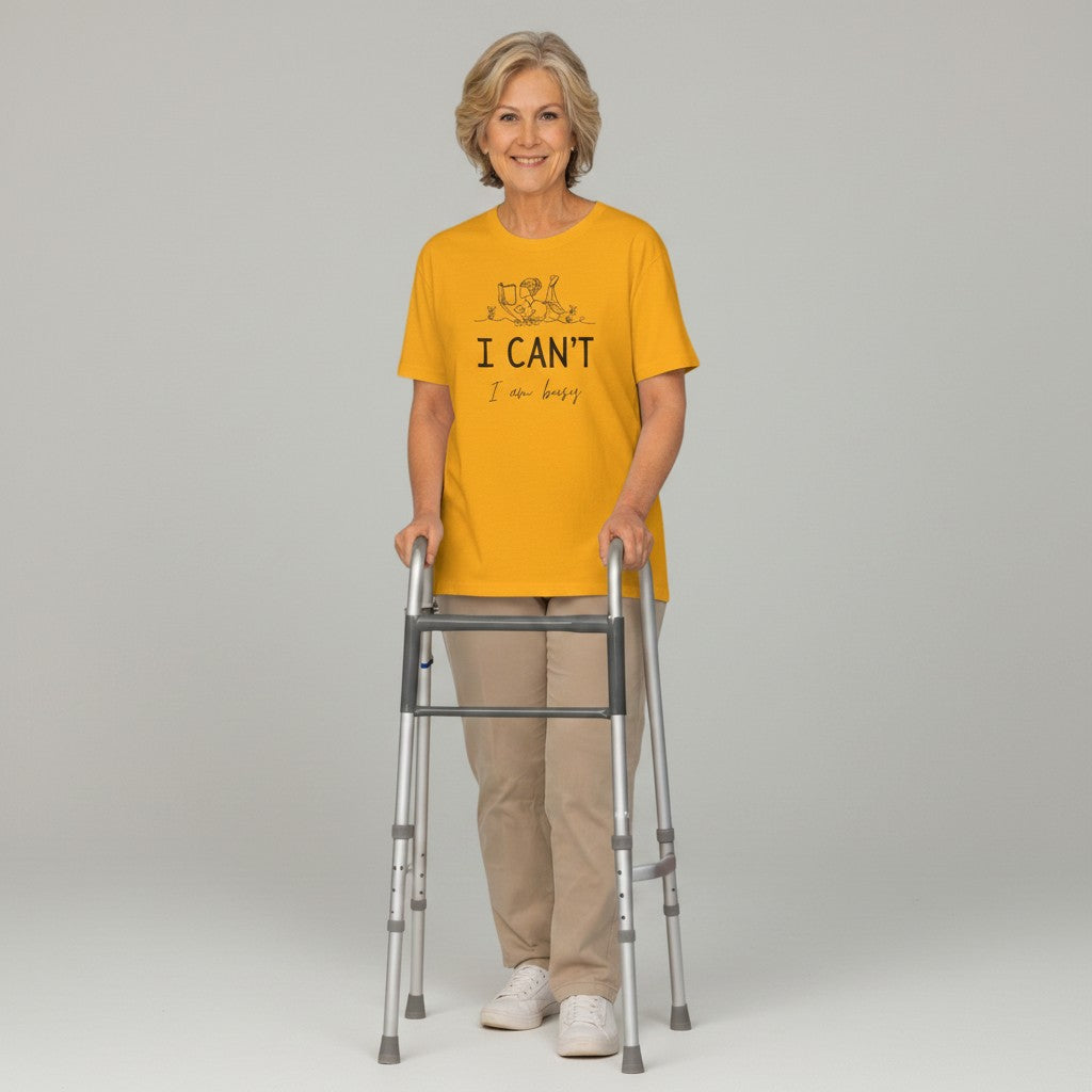 Jena Jewelry yellow 100% cotton t-shirt with a line drawing of a person reading and the text "I CAN'T I am busy".