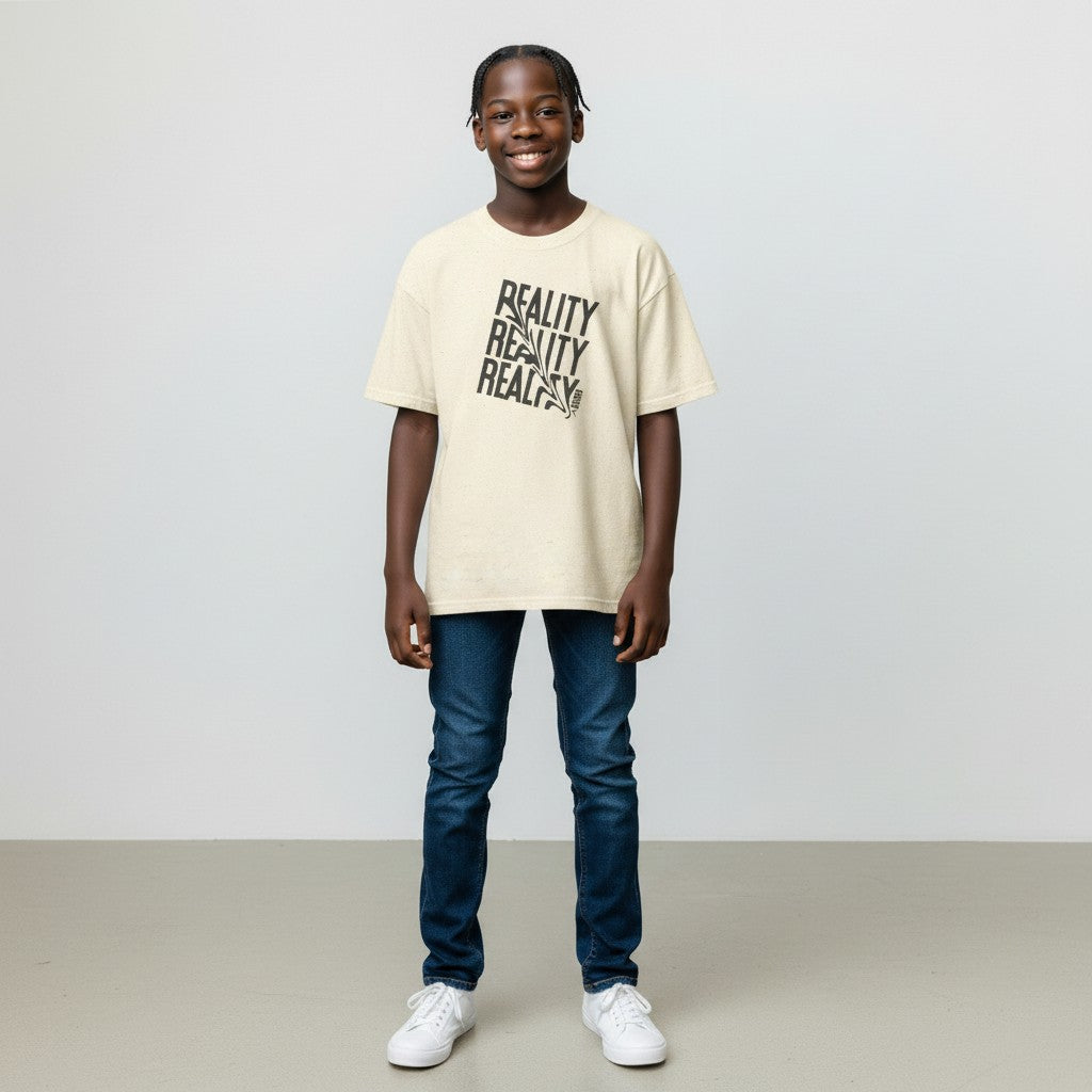 Jena Jewelry cream cotton t-shirt with distressed black "REALITY" graphic text and a small heart detail on the collar.
