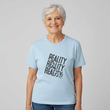 Jena Jewelry light blue 100% cotton t-shirt with distressed diagonal "REALITY" graphic print and crew neck.