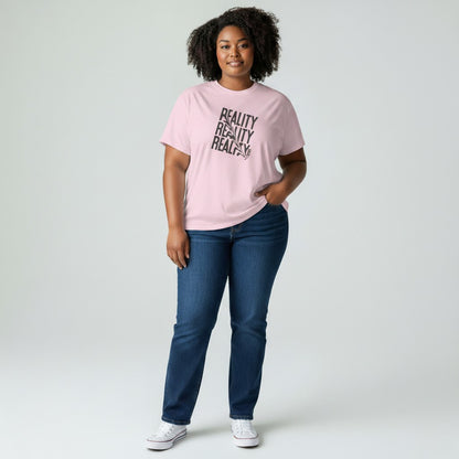 Jena Jewelry pink 100% cotton t-shirt with distressed diagonal text graphic reading "REALITY" three times.