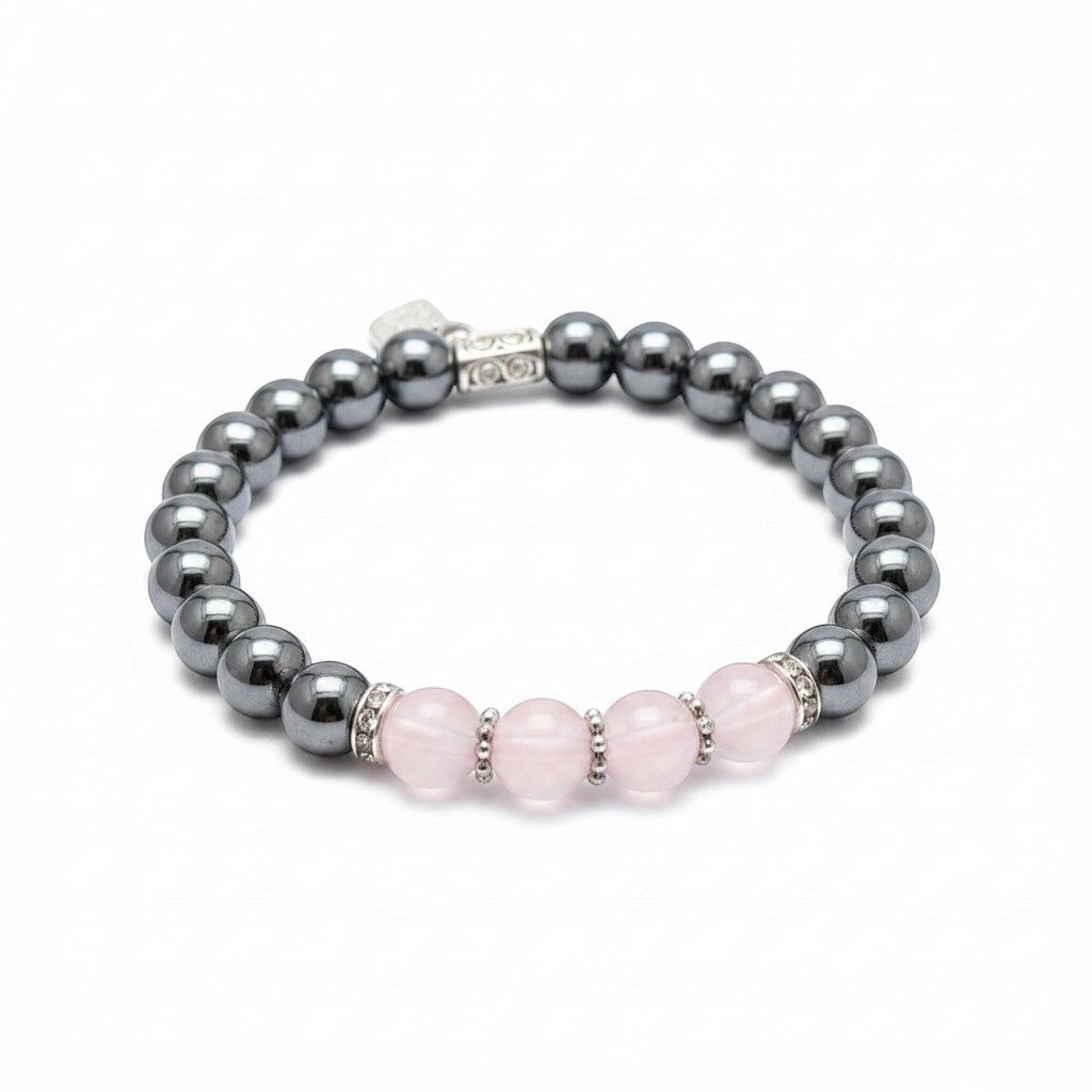 Jena Jewelry stretch bracelet with rose quartz, magnetic hematite, and hematite beads, accented with silver spacers.