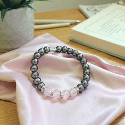 Jena Jewelry bracelet with rose quartz, magnetic hematite, and hematite beads, accented with crystal spacers.