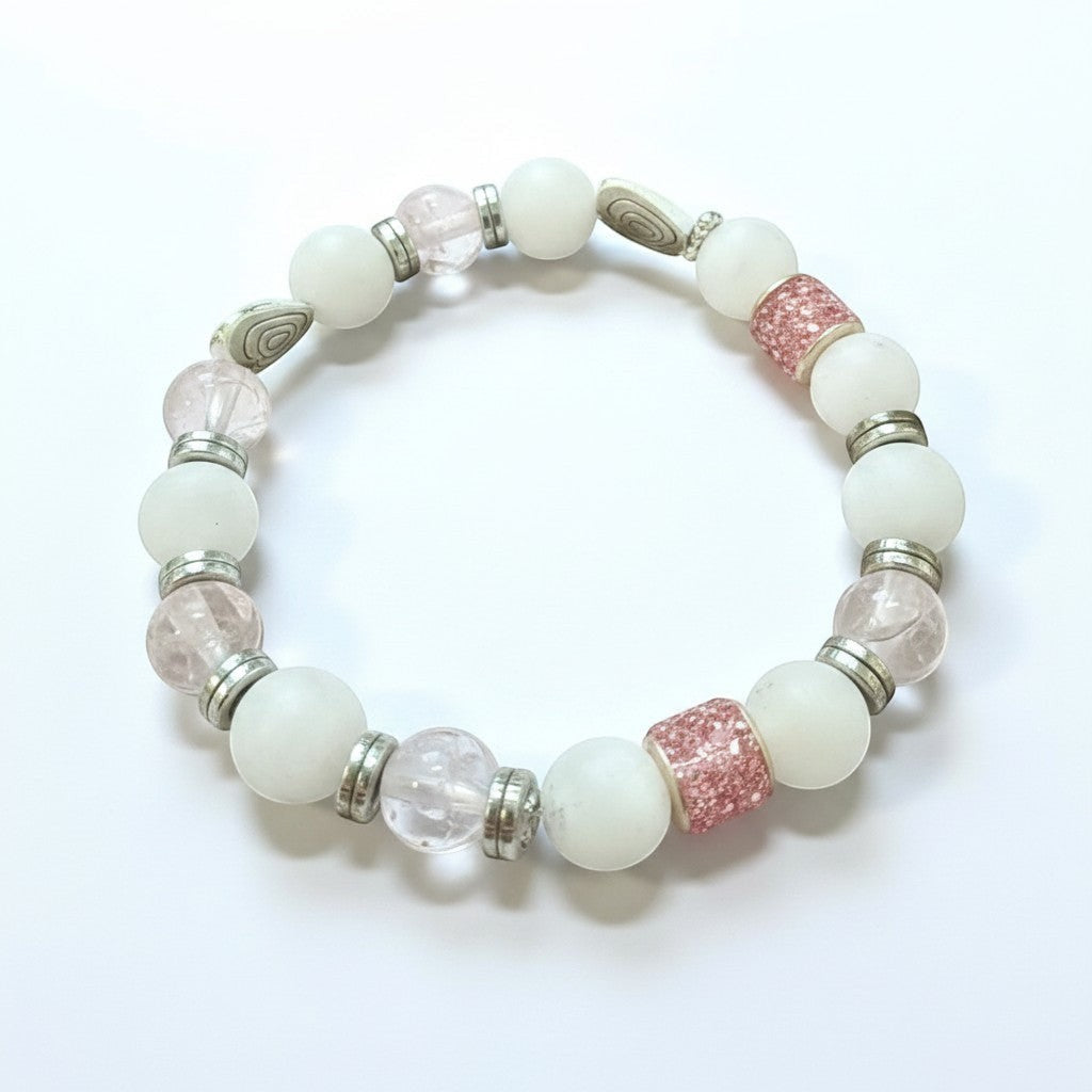 Jena Jewelry stretch bracelet with rose quartz, snow jade, glass beads, and silver accents.