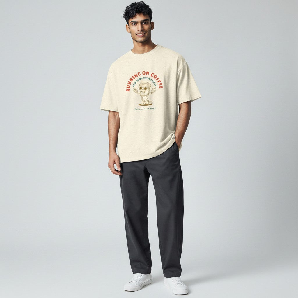 Jena Jewelry cream 100% cotton t-shirt with a retro graphic of a coffee cup saying "Running On Coffee And Good Intentions".