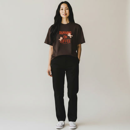Jena Jewelry brown 100% cotton t-shirt with "Running on Coffee and Good Intentions" graphic. Features cartoon coffee cups.