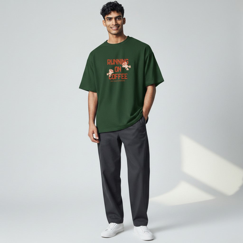 Jena Jewelry dark green 100% cotton t-shirt with "Running on Coffee" graphic and cartoon coffee cups.