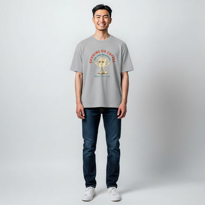 Jena Jewelry grey 100% cotton t-shirt with a retro graphic of a smiling coffee cup with sunglasses and peace signs, text reads "RUNNING ON COFFEE AND GOOD INTENTIONS".