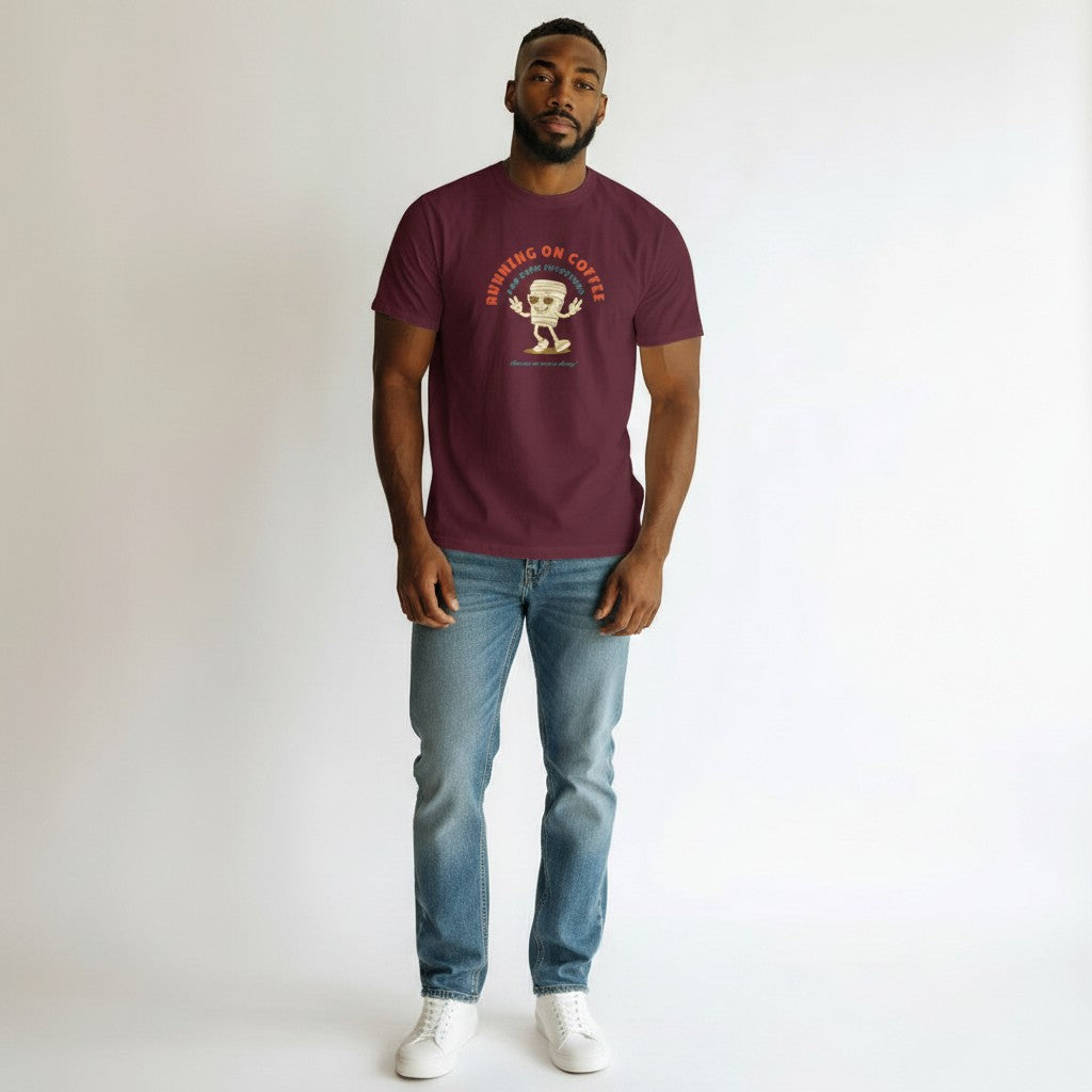 Jena Jewelry maroon 100% cotton t-shirt with a retro graphic of a smiling coffee cup wearing sunglasses and giving peace signs. Text reads "RUNNING ON COFFEE AND GOOD INTENTIONS".