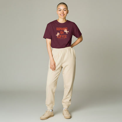 Jena Jewelry maroon 100% cotton t-shirt with "Running on Coffee and Good Intentions" graphic. Features two cartoon coffee cups running.