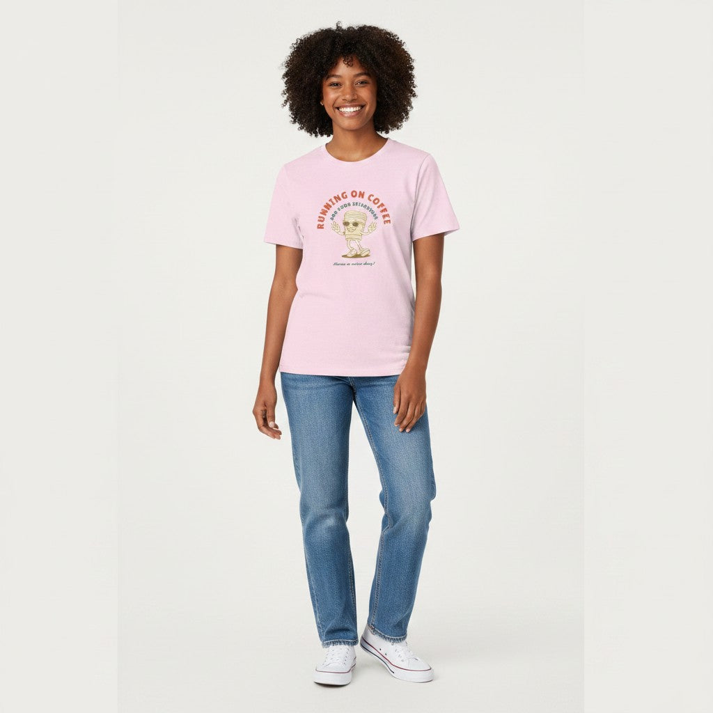 Jena Jewelry pink 100% cotton t-shirt with a retro graphic of a smiling coffee cup wearing sunglasses and giving peace signs, text reads "RUNNING ON COFFEE AND GOOD INTENTIONS".