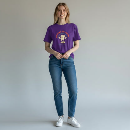 Jena Jewelry purple 100% cotton t-shirt with a retro graphic of a smiling coffee cup and the text "RUNNING ON COFFEE AND GOOD INTENTIONS".