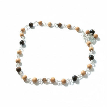 Jena Jewelry Sandalwood and Ebony Blackwood mala anklet with silver chain and heart charm. Alternating light wood and dark wood beads.
