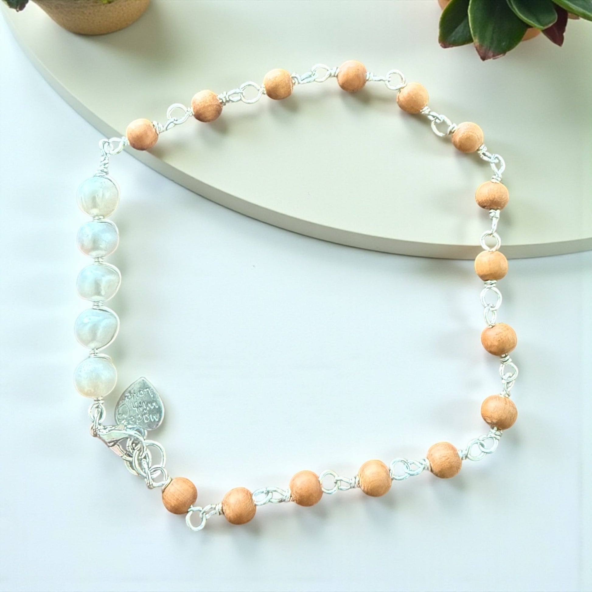 Jena Jewelry anklet with natural sandalwood beads and freshwater pearls, silver chain and clasp.