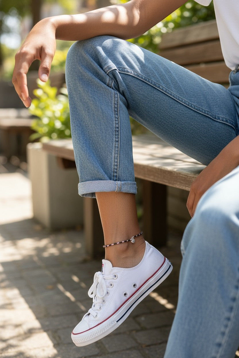 Jena Jewelry handmade seed bead anklet with a small silver charm, featuring alternating dark purple and pink beads.