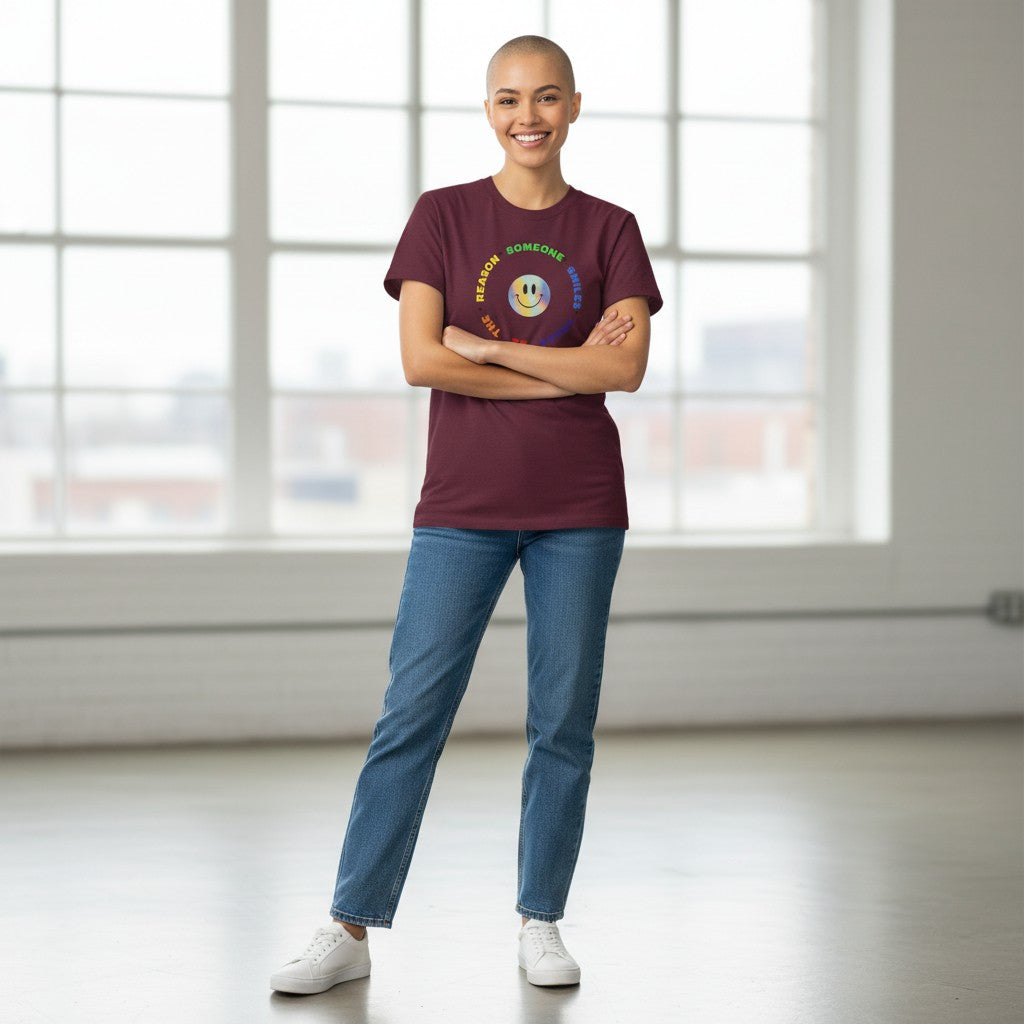 Jena Jewelry maroon 100% cotton t-shirt with a rainbow smiley face graphic and text that reads "Be The Reason Someone Smiles Today".