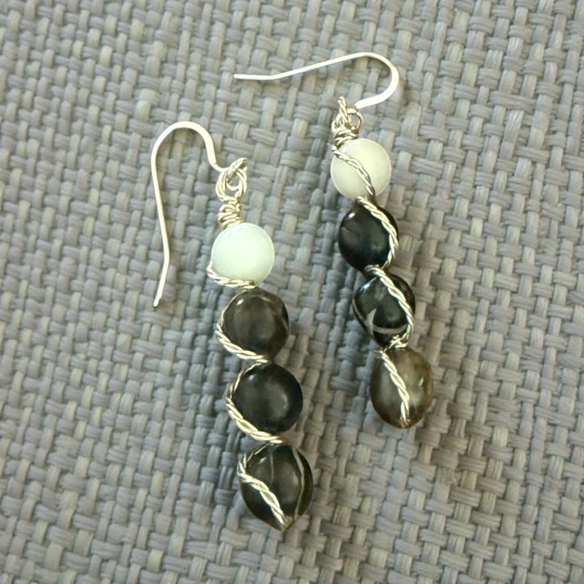 Jena Jewelry stacked drop earrings with white, black, and grey stones, wire-wrapped on silver-tone hooks.