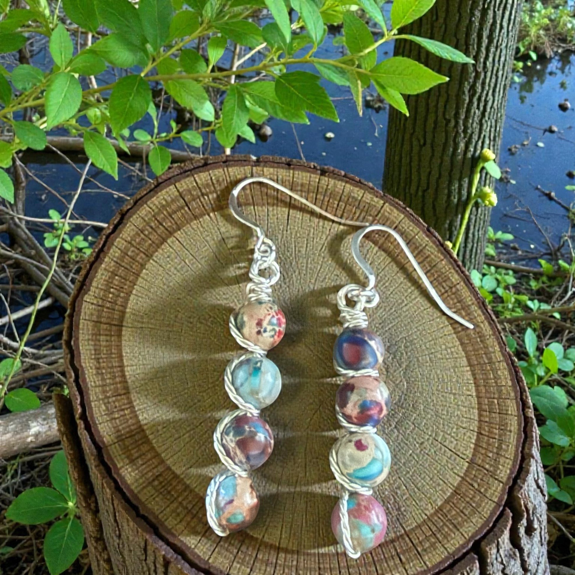 Jena Jewelry stacked gemstone drop earrings with silver-tone wire wrapping and hypoallergenic ear wires. Multi-colored beads.