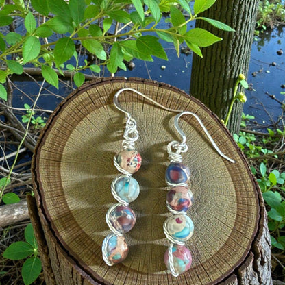 Jena Jewelry stacked gemstone drop earrings with silver-tone wire wrapping and hypoallergenic ear wires. Multi-colored beads.