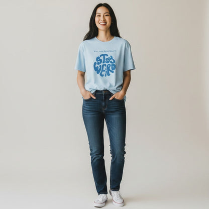 Jena Jewelry light blue 100% cotton t-shirt with a retro blue psychedelic graphic that says "Stay Weird" and "You are perfect!".