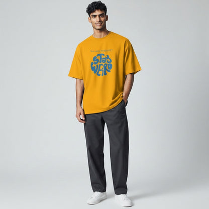 Jena Jewelry yellow cotton t-shirt with blue "Stay Weird" graphic and "You are PERFECT!" text.