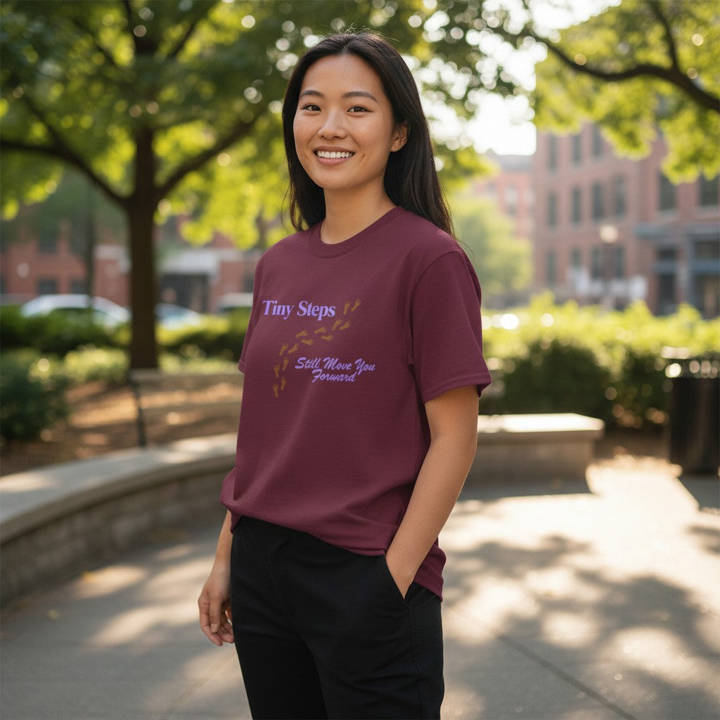 Jena Jewelry maroon 100% cotton t-shirt with "Tiny Steps Still Move You Forward" text and footprint graphic.
