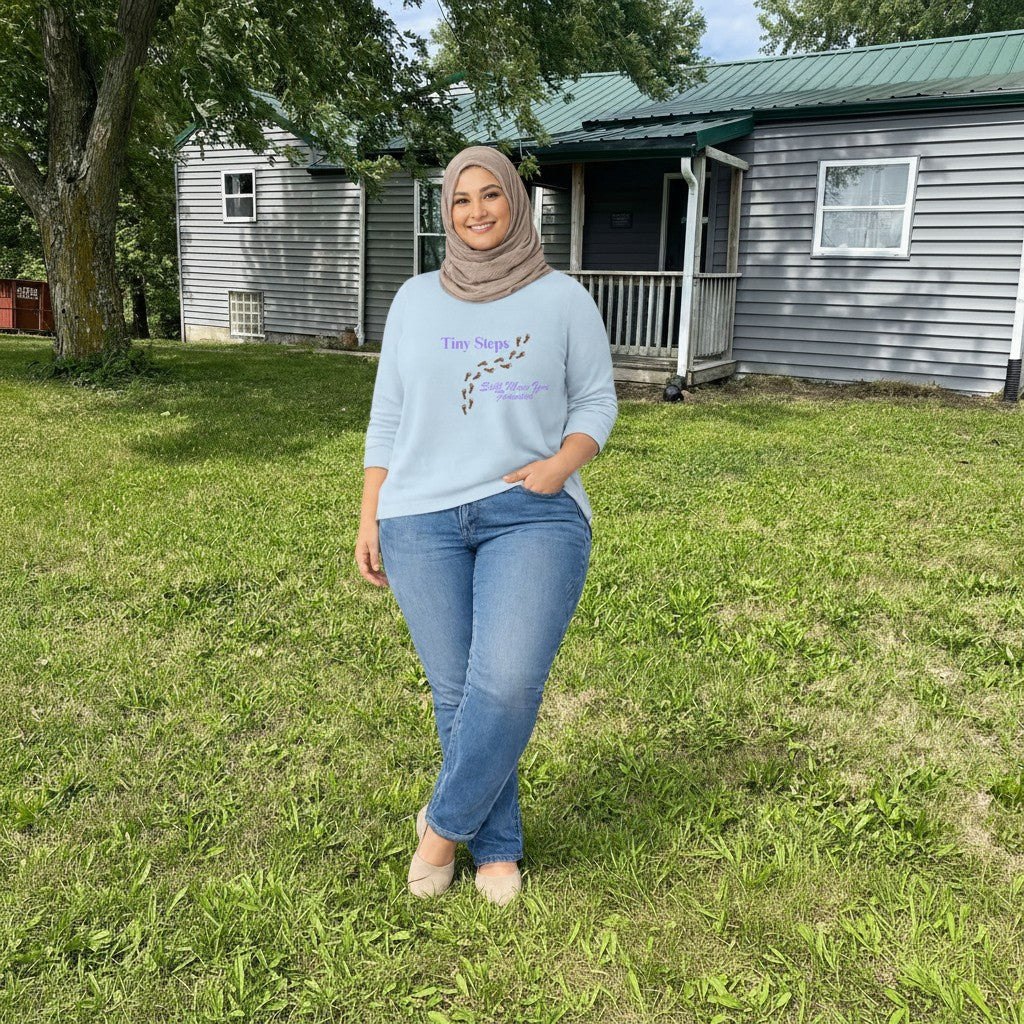 Jena Jewelry light blue 100% cotton t-shirt with "Tiny Steps" and footprints graphic. Inspirational tee.