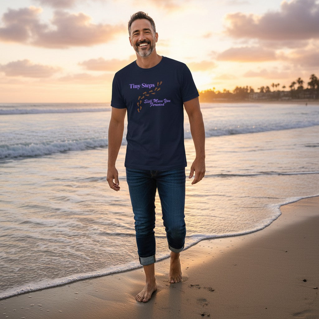 Jena Jewelry navy blue cotton t-shirt with "Tiny Steps" and footprints graphic, and "Still Move You Forward" text.