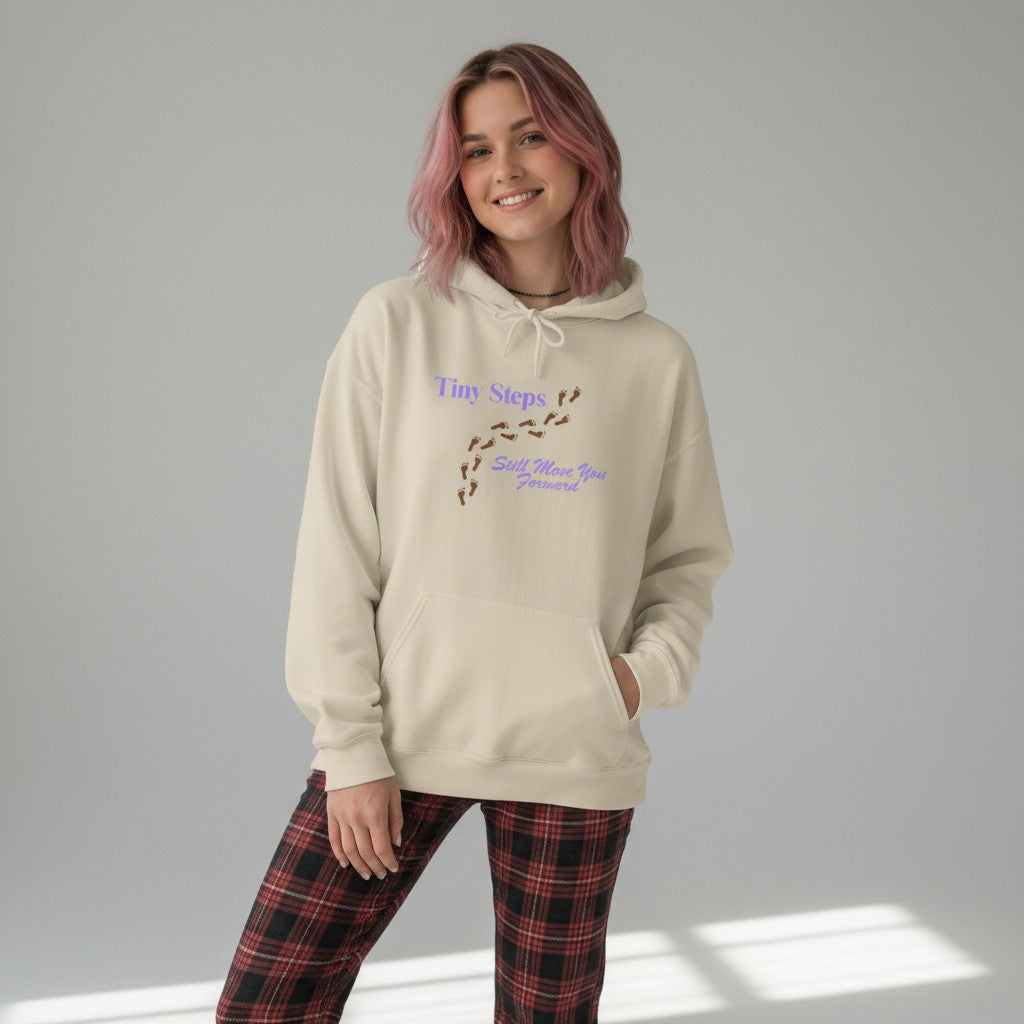 Jena Jewelry beige cotton-poly blend hoodie with "Tiny Steps Still Move You Forward" graphic and footprint design.