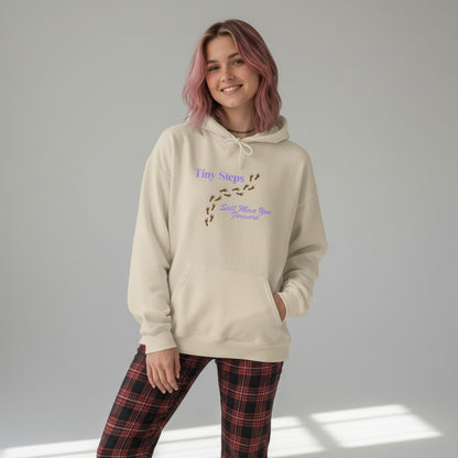 Jena Jewelry beige cotton-poly blend hoodie with "Tiny Steps Still Move You Forward" graphic and footprint design.
