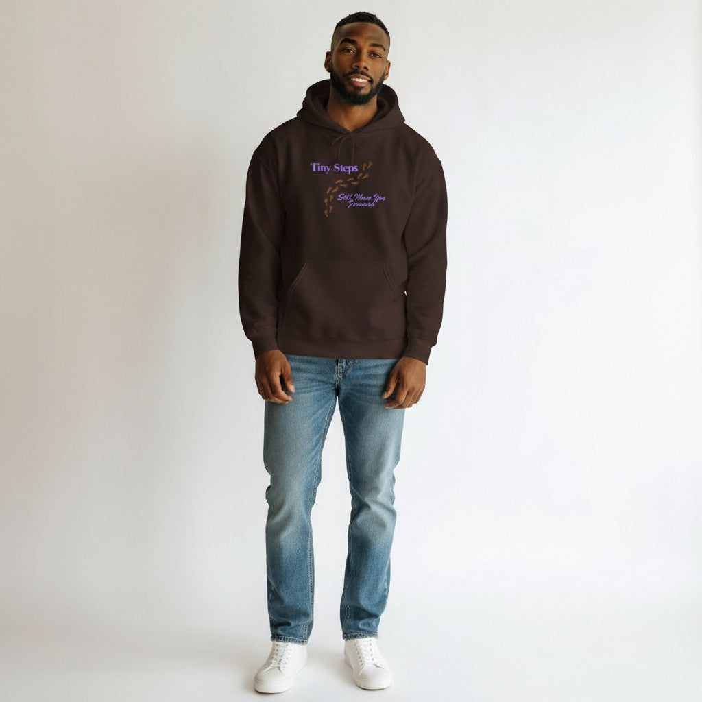 Jena Jewelry brown cotton-poly blend hoodie with "Tiny Steps Still Move You Forward" graphic and footprint design.