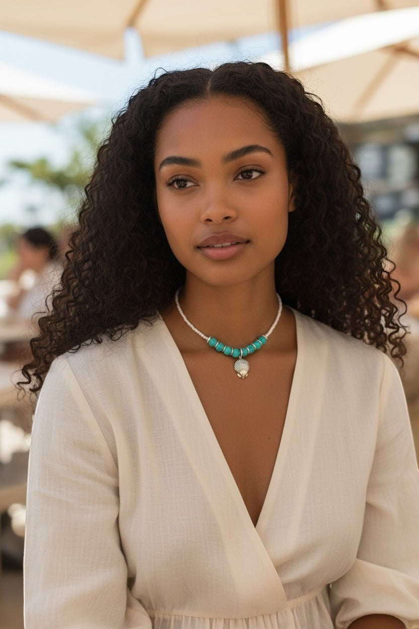 Jena Jewelry turquoise and white seed bead necklace with seashell charm, inspired by coastal calm and ocean energy.