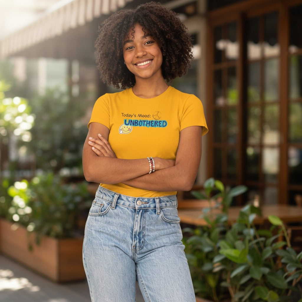 Jena Jewelry yellow cotton t-shirt with "Today's Mood: UNBOTHERED" graphic and smiley face.