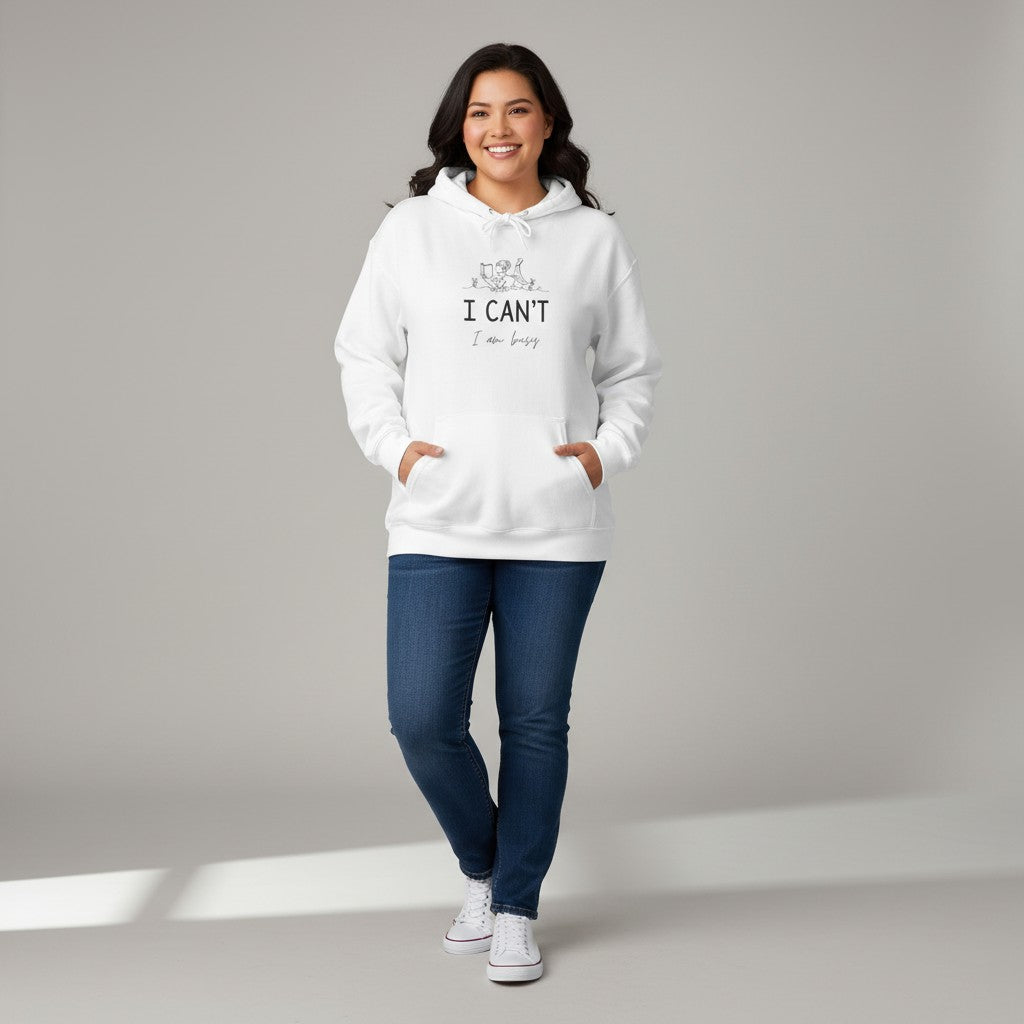 Jena Jewelry white cotton-poly blend hoodie with "I CAN'T, I’m Busy" text and line art graphic. Features a kangaroo pocket and drawstring hood.