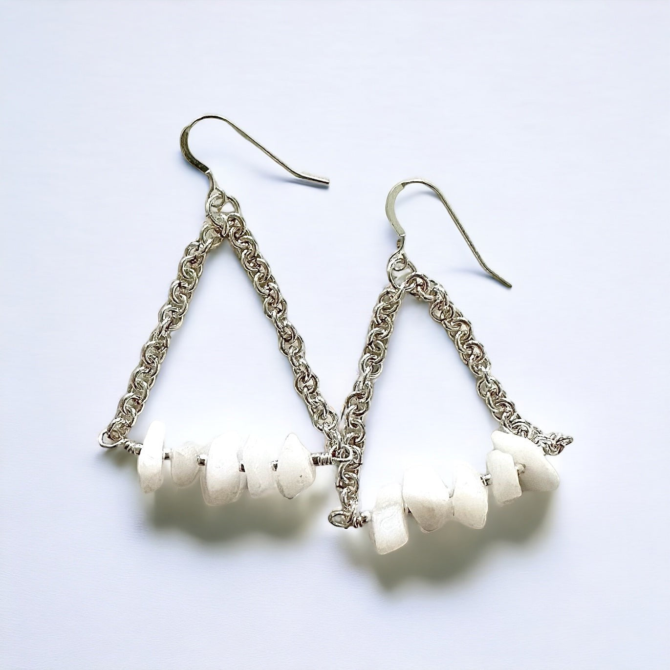 Jena Jewelry silver chainmaille earrings with white chip stones, triangular design, elegant dangle style.