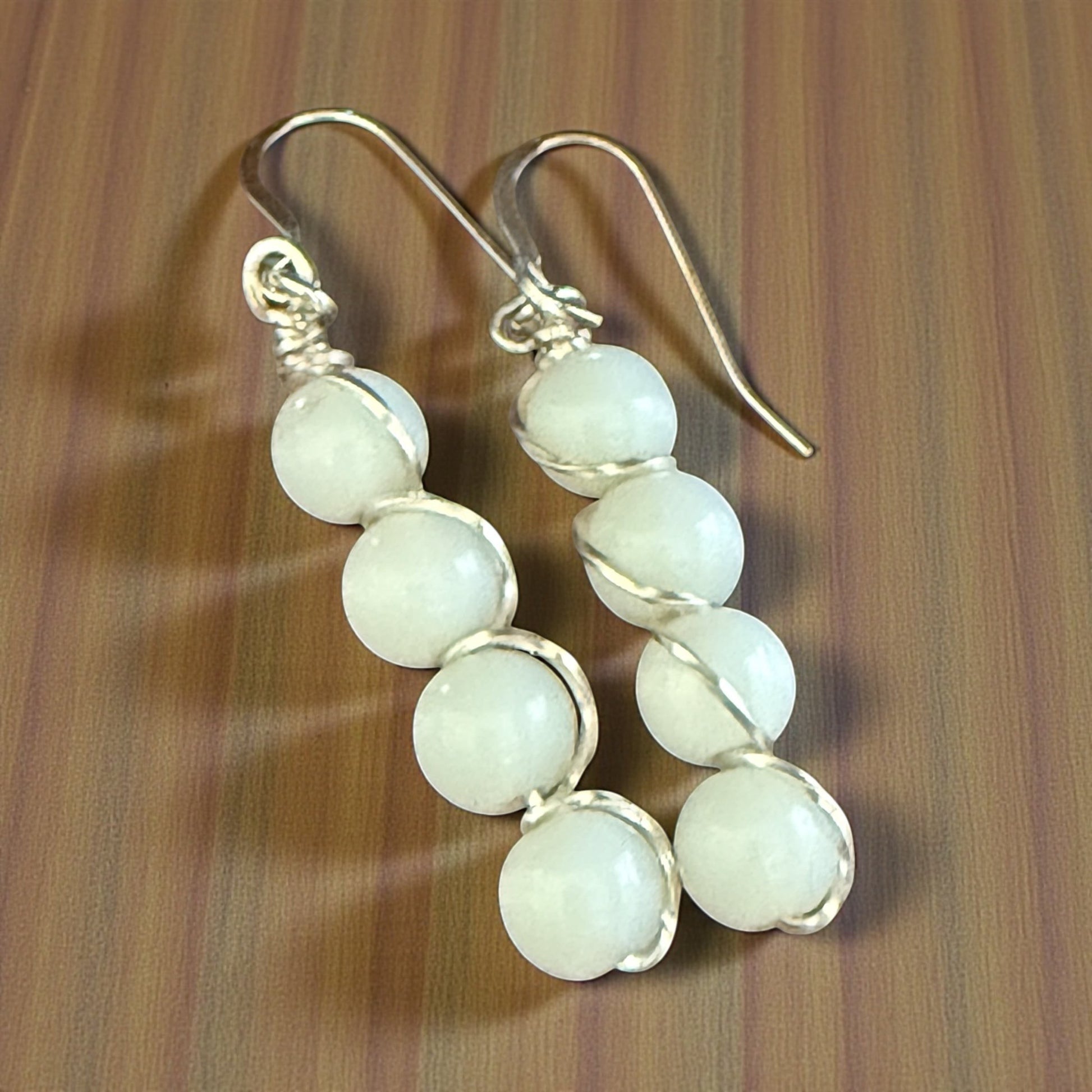Jena Jewelry stacked white gemstone drop earrings with silver-tone wire wrapping on hypoallergenic ear wires.