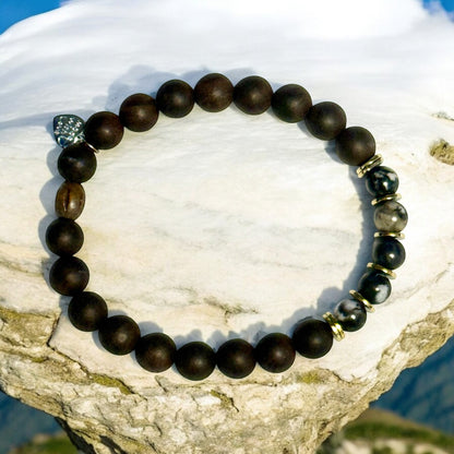 Jena Jewelry grounding strength bracelet with Zebra Jasper, Ebony Blackwood mala beads, and Hematite. Monochrome design.