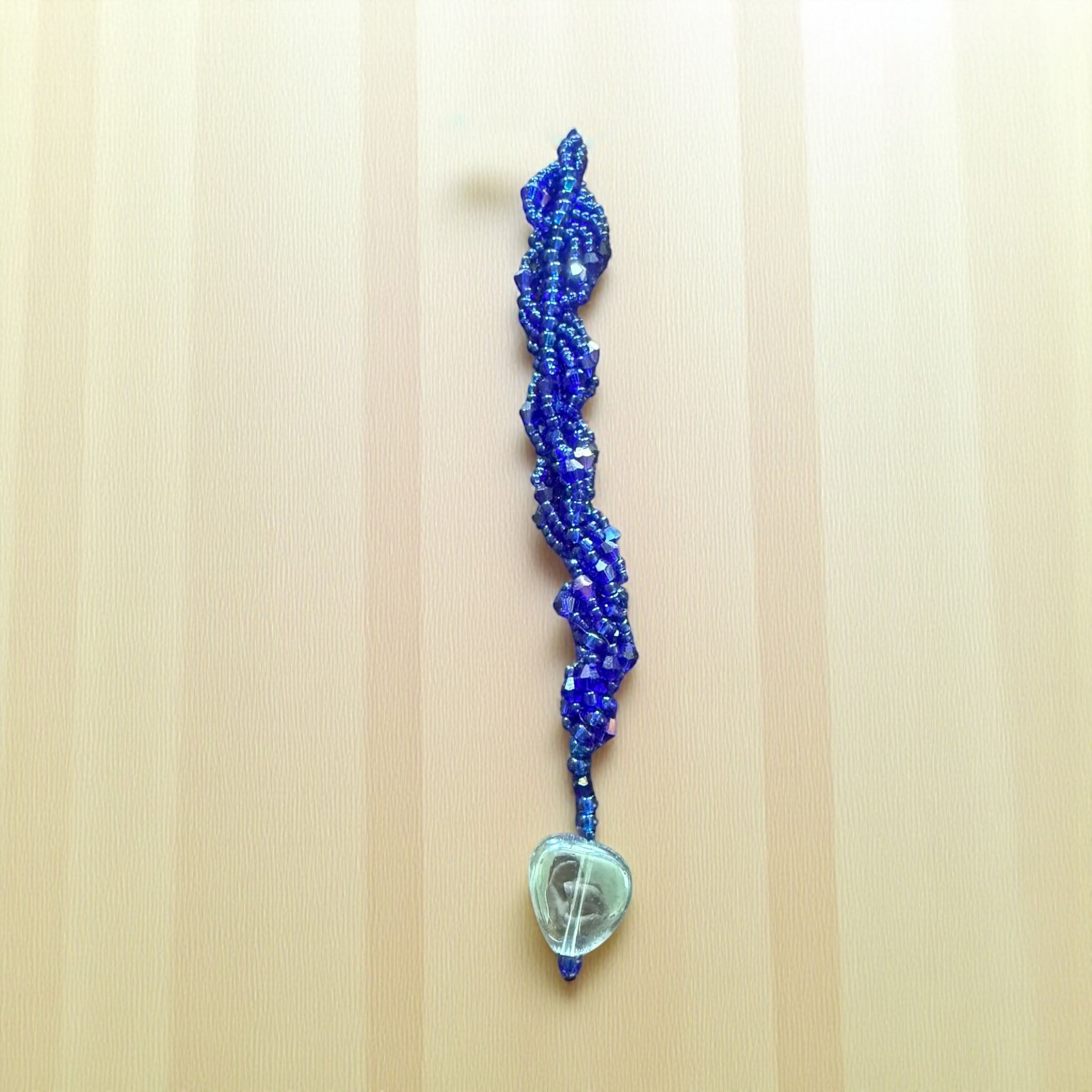 Jena Jewelry blue seed bead icicle ornament with clear glass heart charm, handcrafted for holiday sparkle.