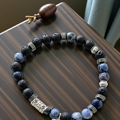 Jena Jewelry blue sodalite and black lava stone stretch bracelet spelling "Let It Go!" in Morse code with silver accents.
