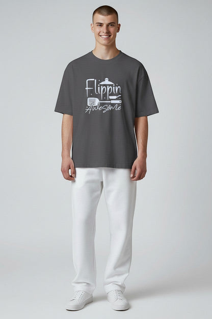 Jena Jewelry men's charcoal grey 100% cotton t-shirt with white "Flippin Awesome" graphic and cooking icons.
