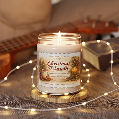 Jena Jewelry Christmas Warmth natural soy candle in a reusable glass vessel, with a warm spice scent.