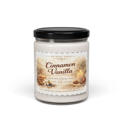 Jena Jewelry Cinnamon Vanilla natural soy candle in a glass jar with a black lid, featuring warm spice and creamy vanilla scent.