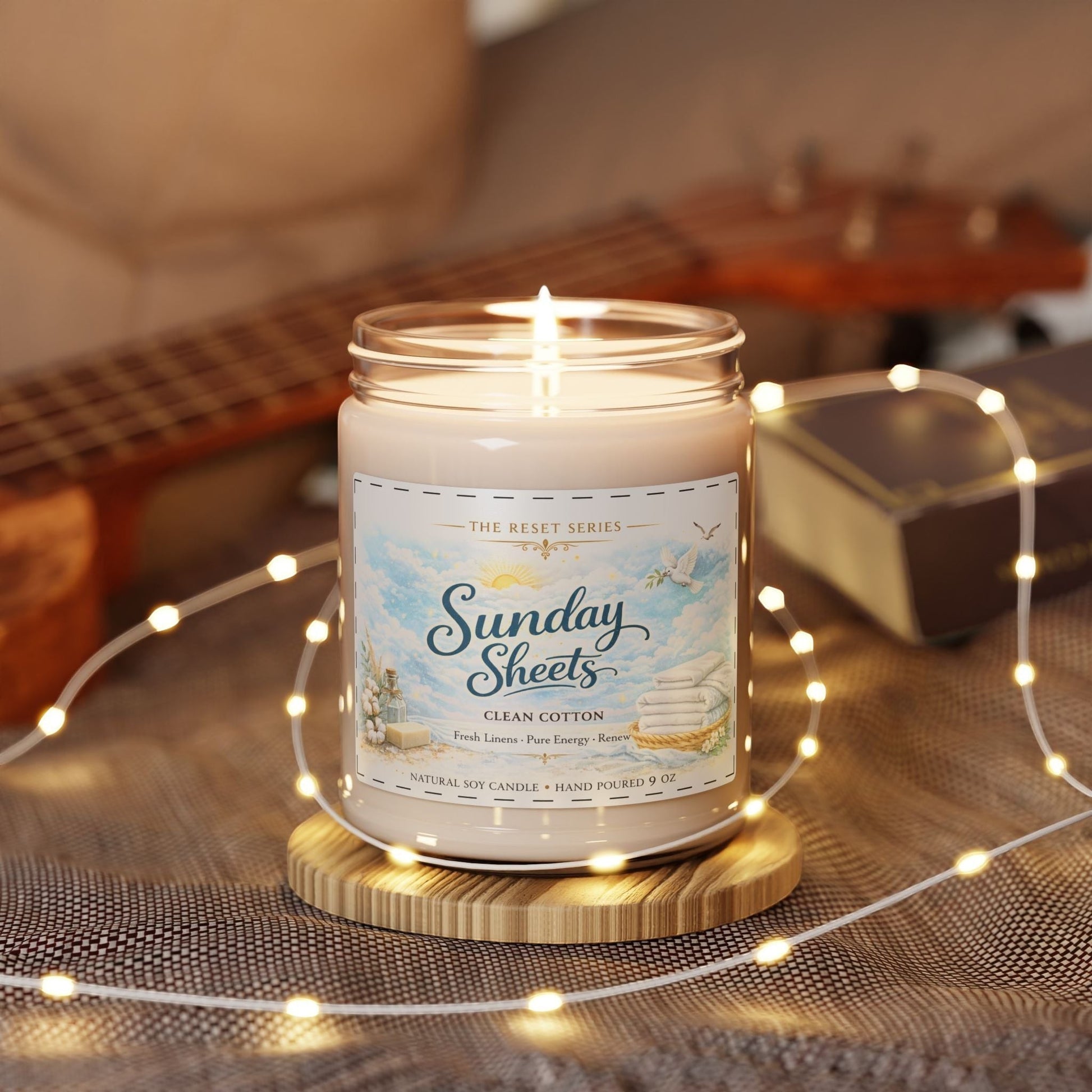 Jena Jewelry Clean Cotton soy candle with a fresh linen scent, in a reusable glass vessel with a cozy home vibe.