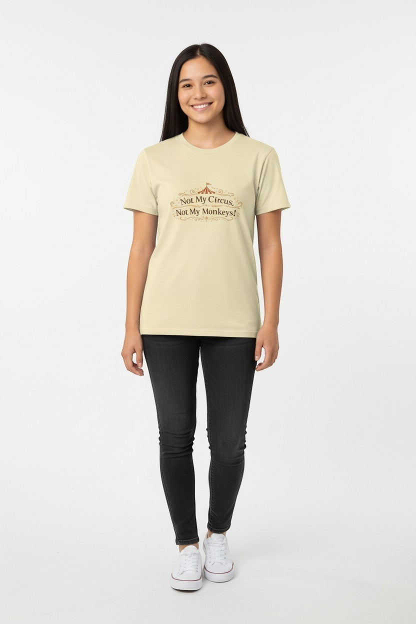 Jena Jewelry light cream cotton tee with "Not My Circus, Not My Monkeys!" graphic print. Model wears black jeans and white sneakers.