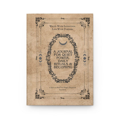 Jena Jewelry Daily Ritual Journal & Planner with a vintage, textured cover featuring ornate black scrollwork and text. The central oval contains 'A Journal for Quiet Power, Daily Rituals & Becoming'.