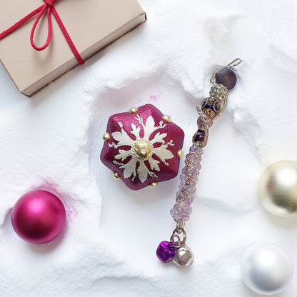 Jena Jewelry handcrafted festive icicle ornament with beads, charms, and jingle bells. Includes a small gift box.