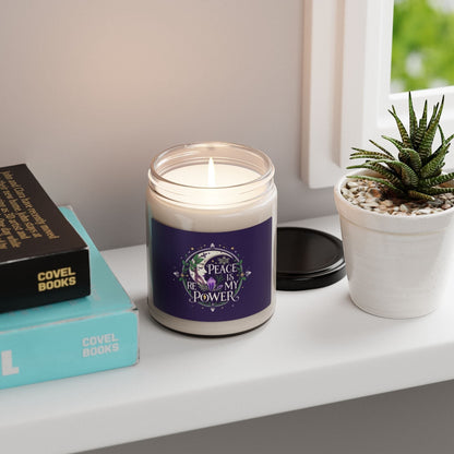 Jena Jewelry floral affirmation candle with "Peace Is My Power" text, moon, crystals, and leaves on a purple label. Clean burning soy wax.