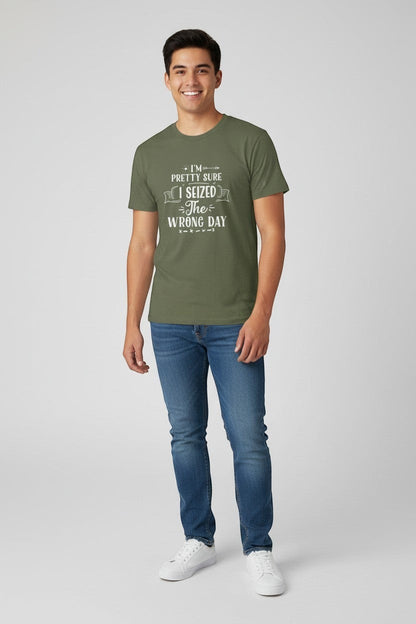 Jena Jewelry olive green 100% US cotton t-shirt with 'I Seized the Wrong Day' graphic print. Model is wearing jeans and white sneakers.
